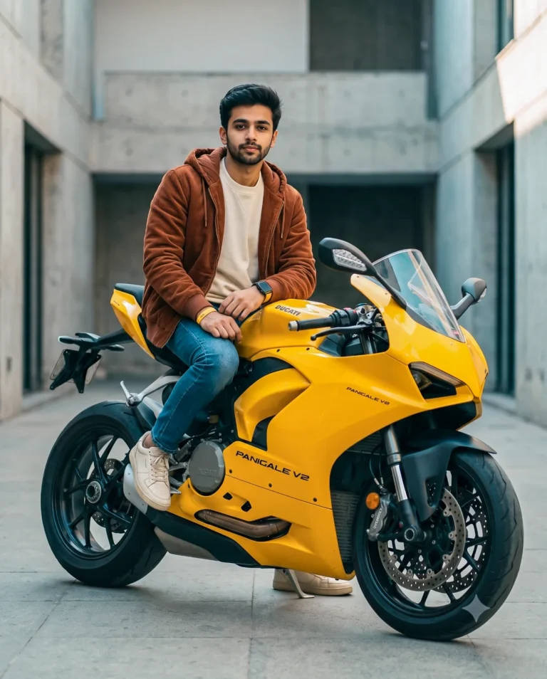 A young man sitting confidently on a motorcycle in a yellow Ducati bike portrait.